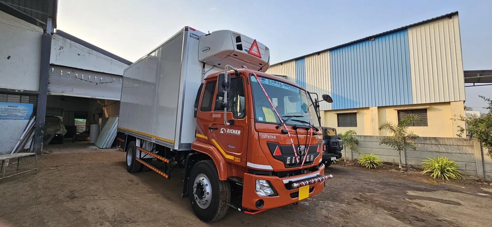 Orange refrigerated commercial truck body